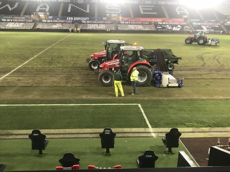Digging up the pitch after the game